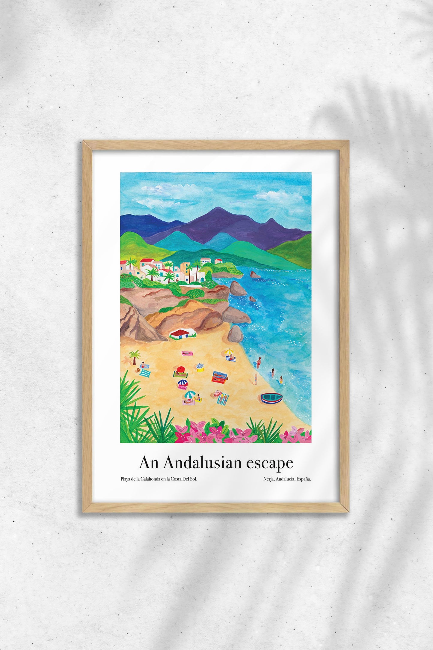 Art poster of a beach scene in Nerja, Spain, framed on a wall.
