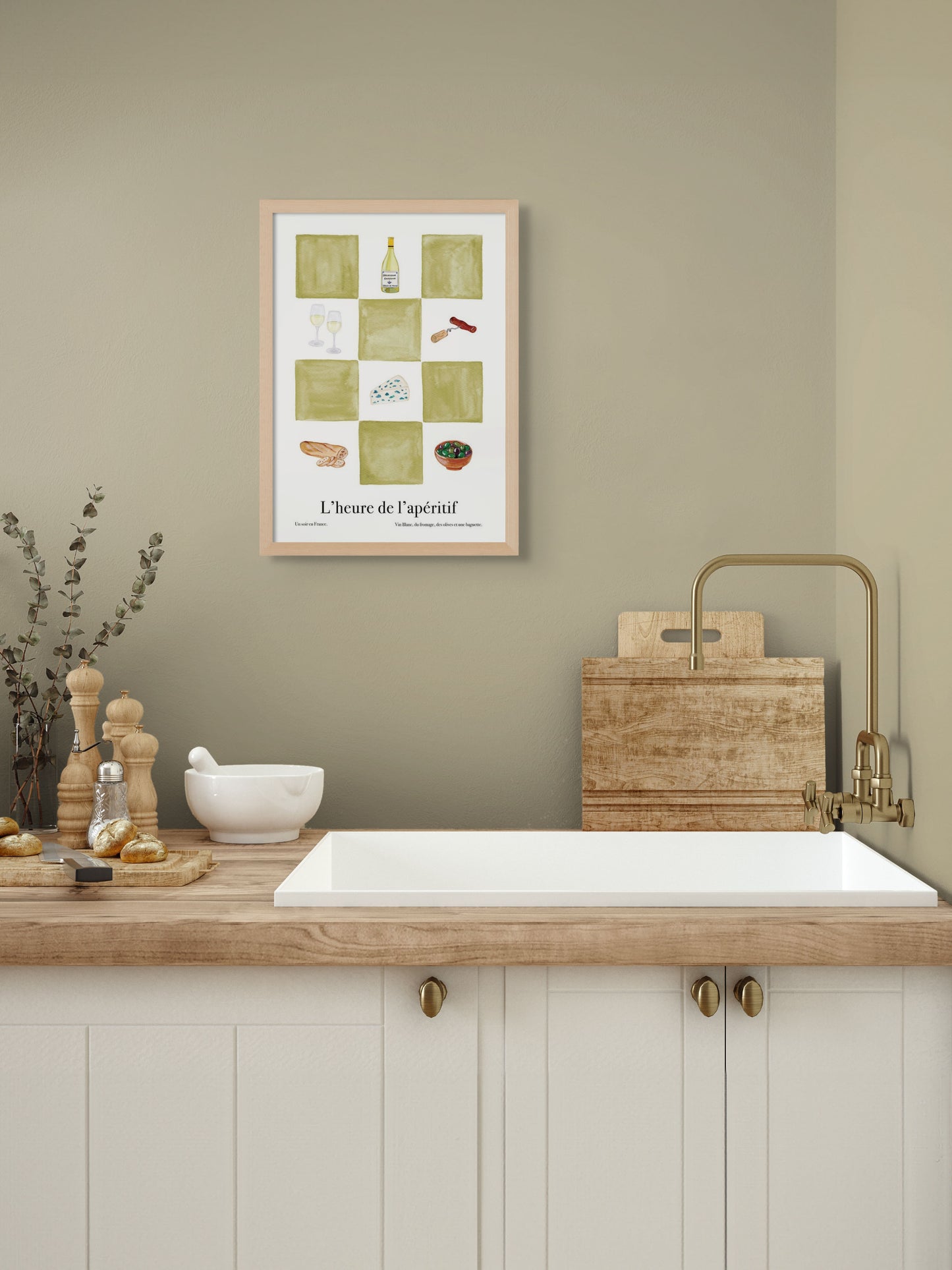 A kitchen with an art poster of green checkers and illustrations of wine and cheese on the wall.