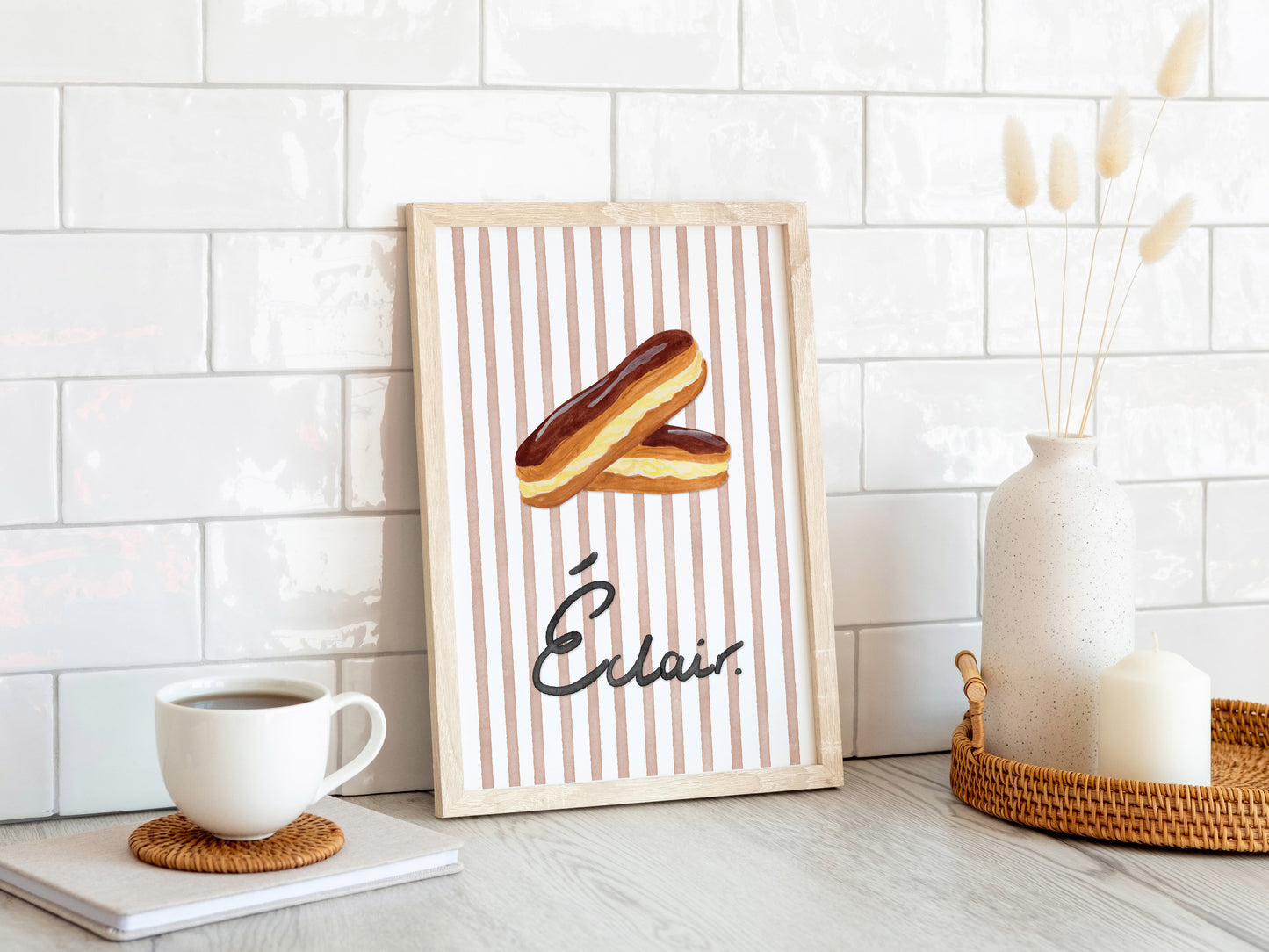 Framed artwork of an Eclair with 'Eclair' branding on a white tiled wall.