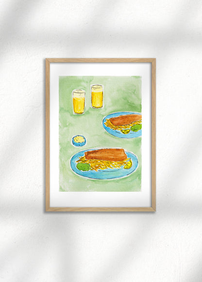 A framed Art Print of English Fish and Chips on a green table with two beers, great for kitchen decor