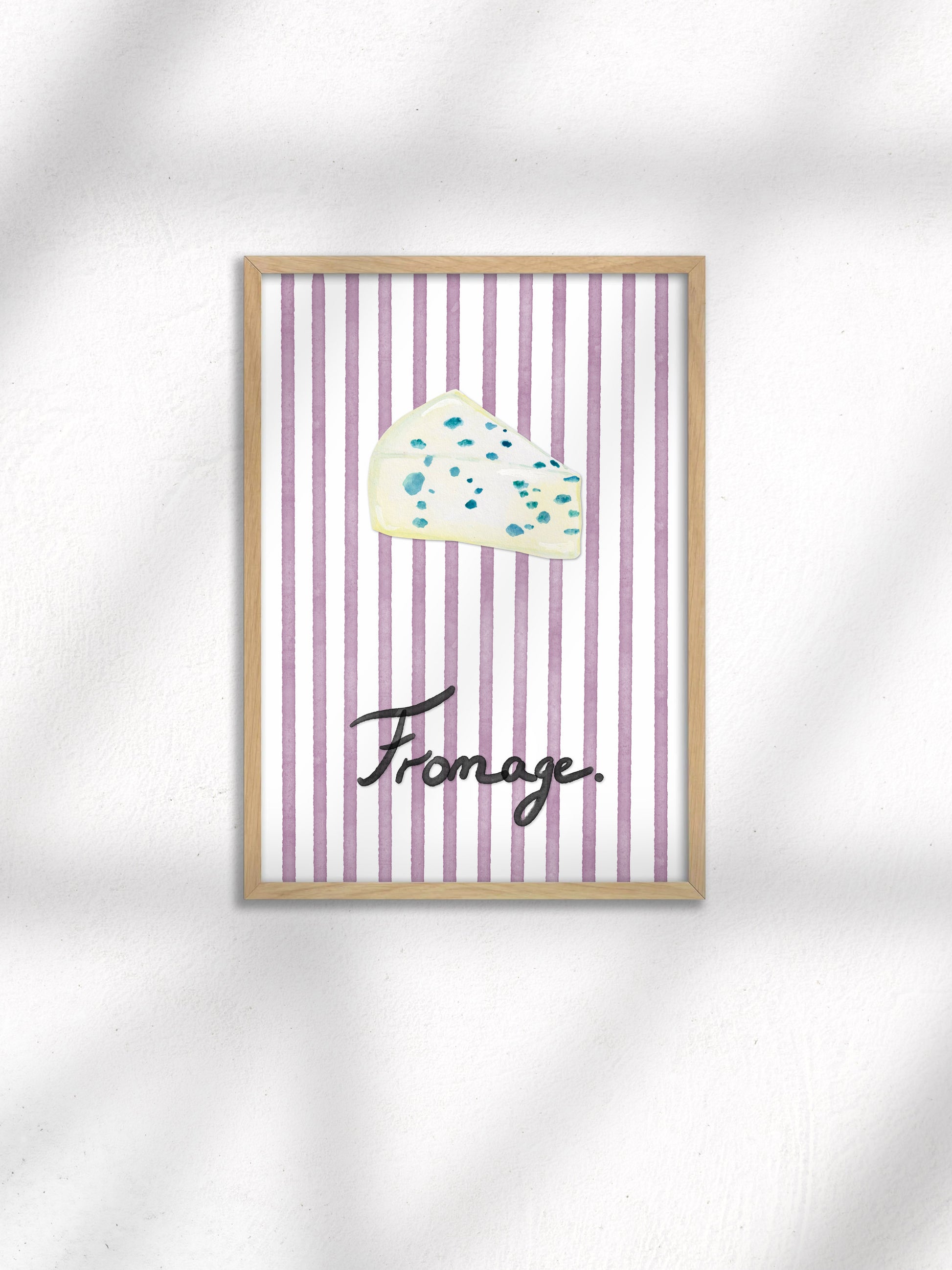 Framed artwork with a cloud illustration and the word 'Fromage' on a striped background.