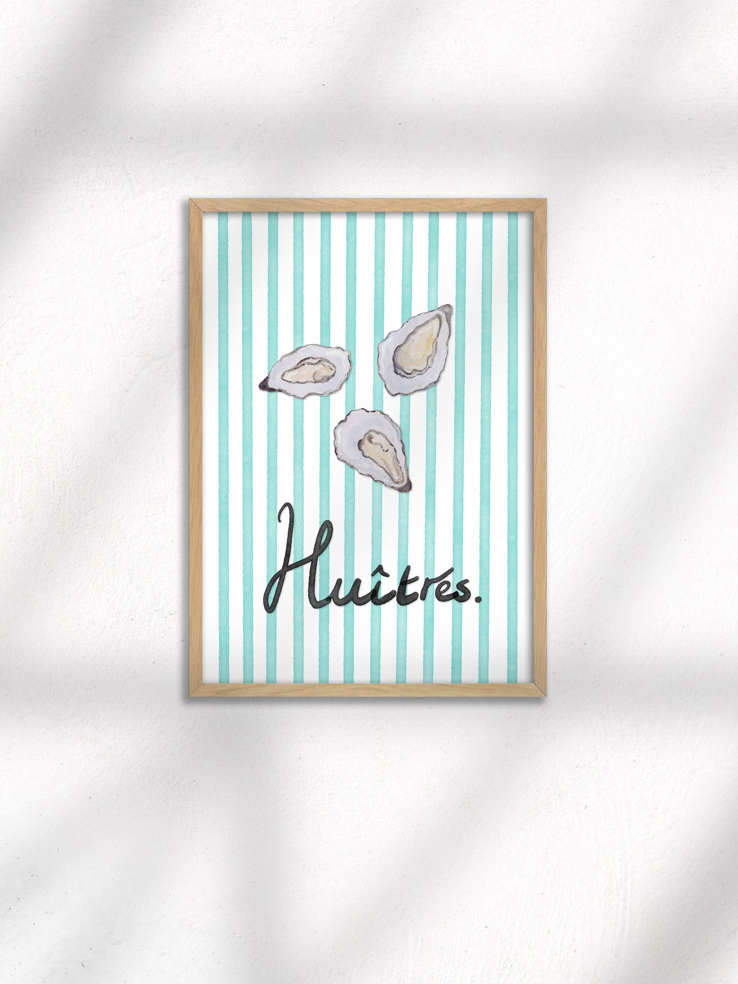 Framed artwork with oyster illustrations and the word 'Huitres' on a striped background.