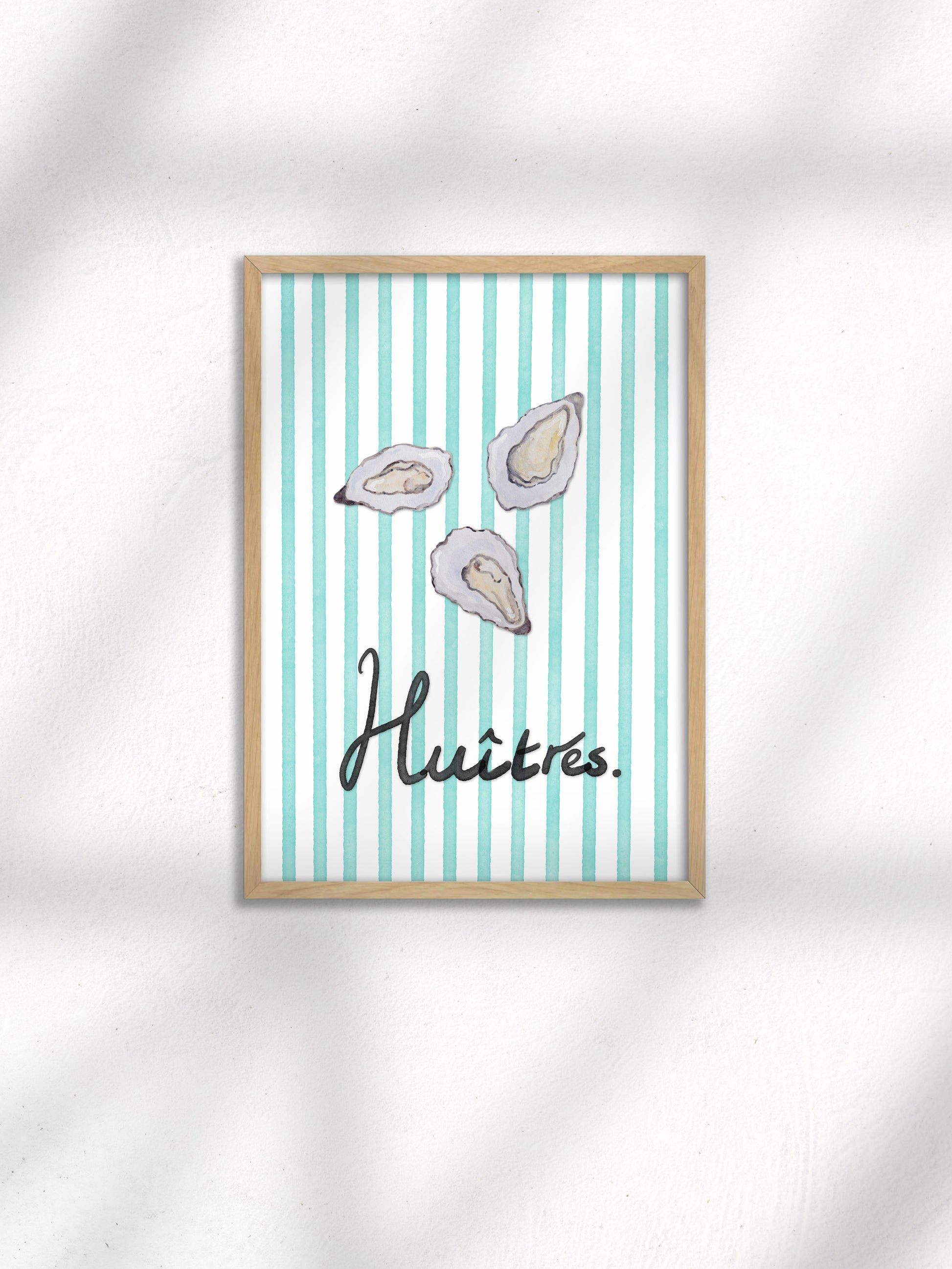 Framed artwork with oyster illustrations and the word 'Huitres' on a striped background.