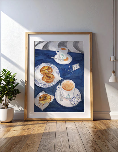 Framed artwork of coffee and Portuguese pastries on a wall in a bright room.