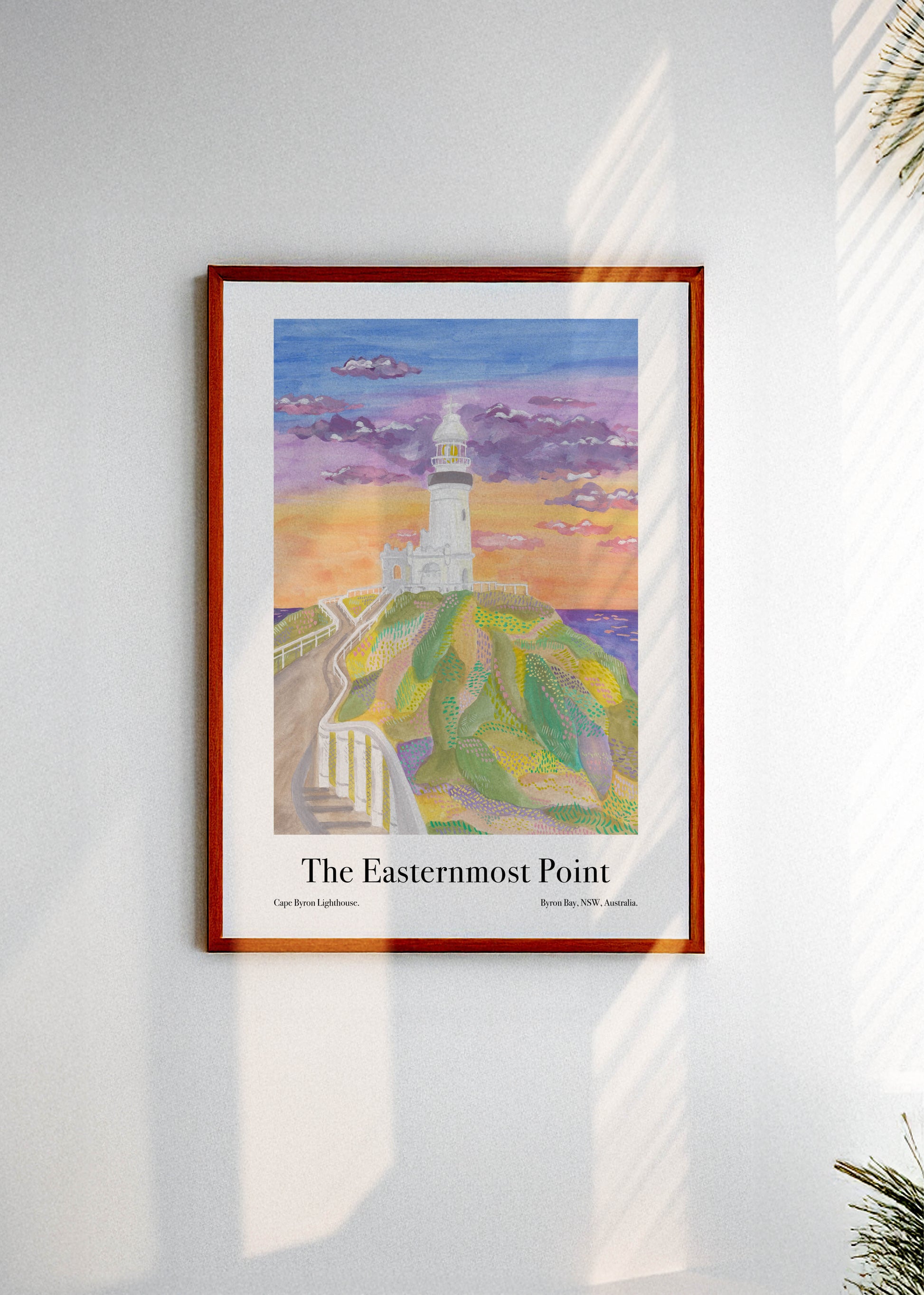 A framed art poster with the Byron Bay Australia lighthouse and the text: "The Easternmost Point"